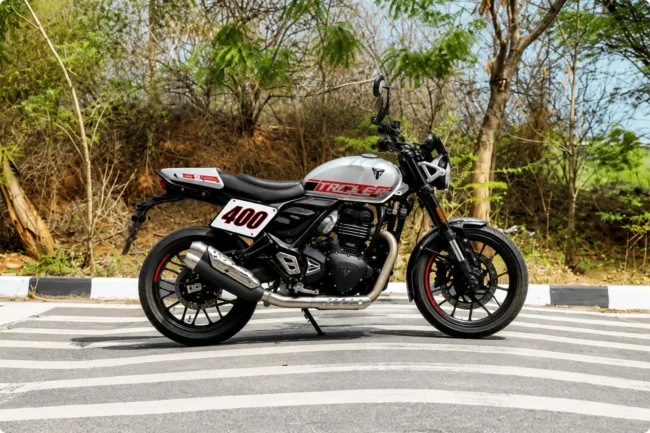 Triumph Tracker 400 in India Expected Price Specs Mileage and Review 5 Triumph Tracker 400 seat height 805mm with rider showing upright flat handlebar posture